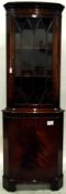 Georgian style mahogany bowfront corner cupboard, the upper section with dentil frieze,