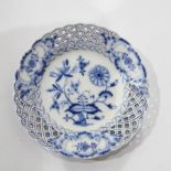 Blue and white porcelain circular dish with floral pattern and pierced border,