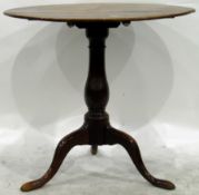 19th century oak circular top tripod table on turned baluster column, with splayed legs,