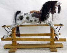 Dapple grey rocking horse, with horse hair mane and tail, mounted on a pine twin-pedestal support,
