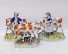 Pair of Staffordshire pottery figure groups,