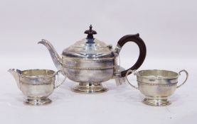 Early 20th century silver three-piece teaset to include circular pedestal teapot with gadrooned rim,