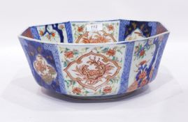 A Japanese octagonal bowl, sides decorated decorated in the Imari palette with flowers, bats etc,