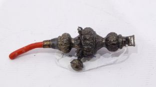 Victorian silver rattle with coral handle, ornate foliate decorated and bells (some detached),