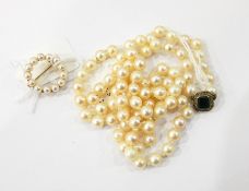 String of cultured pearls with white metal clasp and a gold and pearl circlet brooch