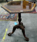 Reproduction mahogany tilt-top tripod table with hexagonal top with gadrooned border,