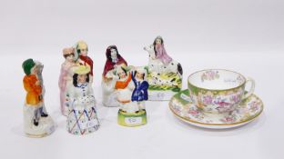 Various Staffordshire figure groups and a Minton's china tea cup and saucer (7)