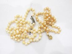 Single strand of uniform cultured pearls with a 9ct gold ropetwist clasp and a second single row of