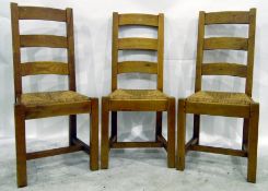 Set of six matching ladderback dining chairs with rush seats,