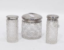 Edwardian silver topped cut glass dressing table jar with hammered decoration to the lid,