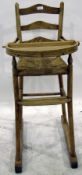 Child's elm high chair with ladder back,