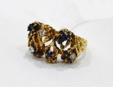 Gold coloured ring of textured design, set with sapphires and diamonds,