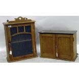 Old pine wall cupboard with glazed door enclosing shelf,