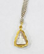 Gold(?) Thai pendant, triangular-shaped with buddha encased to the centre,