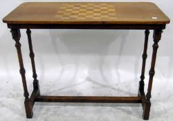 Victorian walnut games table, the rectangular top with chequerboard inlay,