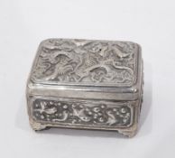Chinese silver lidded box decorated with repousse decoration of a dragon,