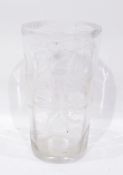 Cut and etched glass vase, the body tapering, decorated with lilies, serrated border,