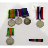 George VI group of three medals and another