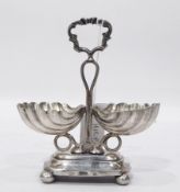 Polish silver-coloured metal shell caviar stand, the central scroll handle,