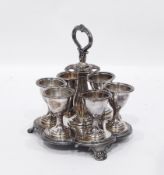 Silver plated egg cruet having six egg cups with scroll handle lobed baluster column,