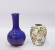 Moorcroft purple baluster shaped vase and another Moorcroft squat vase with incised floral