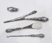 Silver-handled button hook, shoe horn and glove stretchers,
