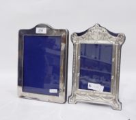 Modern silver-mounted photograph frame with arch and scroll top,