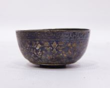 Antique Thai silver and niello small bowl with allover scrolling foliate decoration,