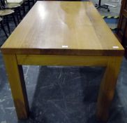 Modern oak dining table, the rectangular top above a plain frieze, on square legs,