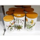 Six Portmeirion 'The Botanic Garden' pattern large storage jars with wooden lids and three smaller