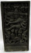 Old rectangular heavily carved panel from Arunachal Pradesh, depicting deity surrounded by figures,