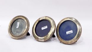 Three photograph frames with silver mounts all of circular form (3)