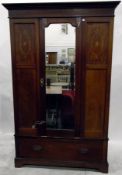 Edwardian mahogany and satinwood inlaid wardrobe, the central mirrored door with bevelled plate,