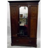 Edwardian mahogany and satinwood inlaid wardrobe, the central mirrored door with bevelled plate,