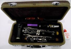 Clarinet within its original case, with cleaner, marked 'Boosey & Hawkes,