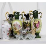 Pair of Edwardian pottery vases with green ground, baluster-shaped with gilt scroll handles,