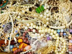 A quantity of costume jewellery to include simulated pearl necklaces, necklaces,