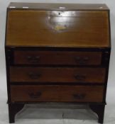 Edwardian mahogany bureau, the fall front with inlaid shell decoration over three long drawers,
