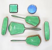 Green guilloche enamel and silver plated dressing table set including two clothes brushes,