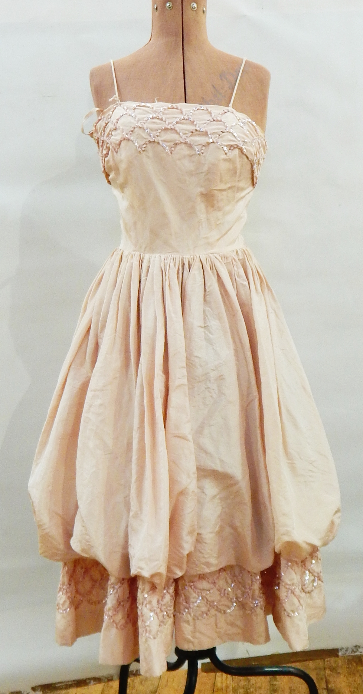 1950's apricot satin strapless ball gown with sequin details and a puffed skirt,