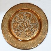 "Tree of Life" copper carved charger with later Arts & Crafts decoration,