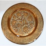 "Tree of Life" copper carved charger with later Arts & Crafts decoration,