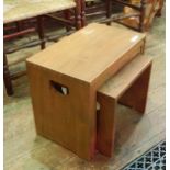 An Ercol style nest of four tables, with handle holds to the sides , 51 x 30 cms approx .