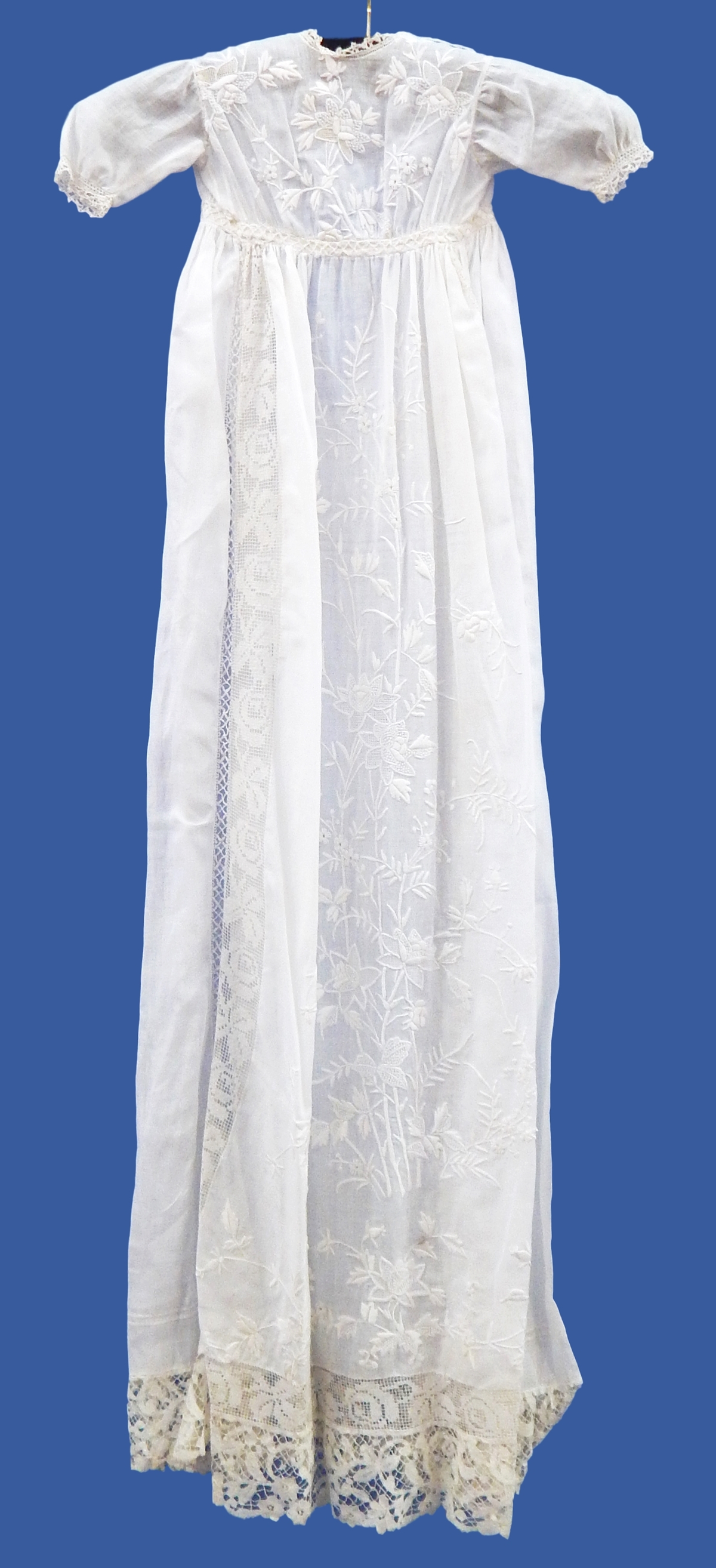 Early 19th century christening gown embroidered with flowers, lace panels with its petticoat,