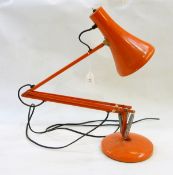 Modern orange anglepoise desk lamp,