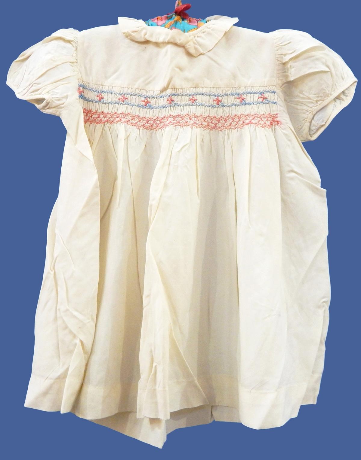 Quantity of early 1940's and 50's child's dresses including cream silk smocked,