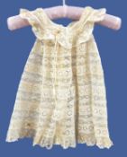 Early 19th century child's lace dress and a small sampler with alphabet and numbers (2)