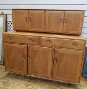 Ercol light elm elm dresser with a pair of cupboards to top,