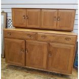 Ercol light elm elm dresser with a pair of cupboards to top,