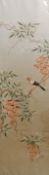 Oriental embroidered picture on silk depicting a bird sitting on a blossom tree branch,